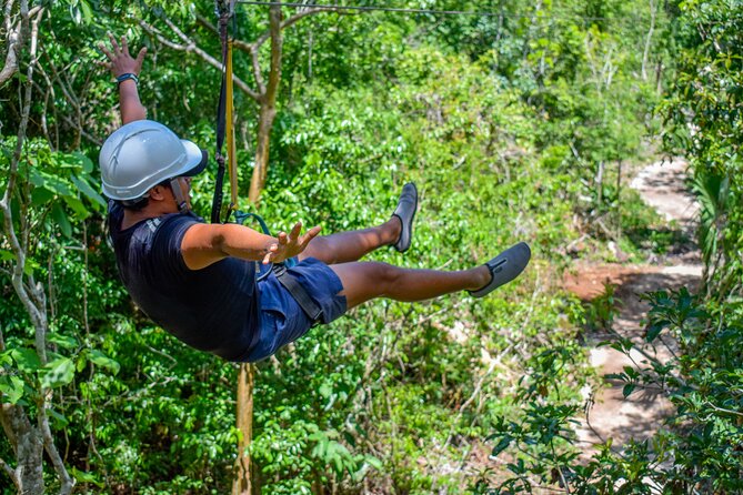 Action-packed Cancun ATV tour, Ziplines, Cenote, Lunch and More - Swimming in a genuine cenote