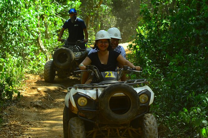 Action-packed Cancun ATV tour, Ziplines, Cenote, Lunch and More - Riding ATVs through the Mayan jungle