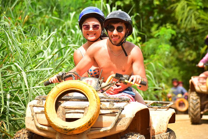 Adventure in Puerto Morelos: ATVs, Ziplining, Cenote Exploration - ATV riding through rocky ground and mud