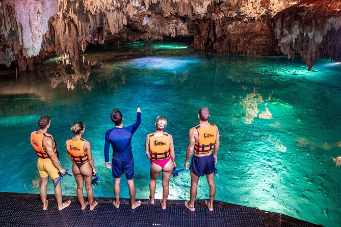Akumal Cenote Swimming and Snorkeling from Cancun & Costa Mujeres - Swimming beneath the rock at Akumal