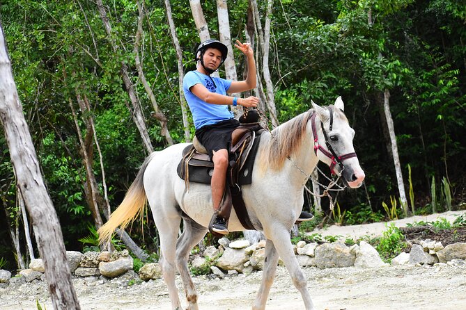 ATV (shared), Horse Back Riding, Ziplines, & Cenote from Cancún - Ziplining above the jungle