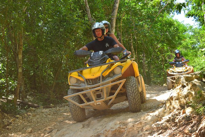 ATV Single & Zip Line from Cancun - Entering the clear water of a Mayan cenote