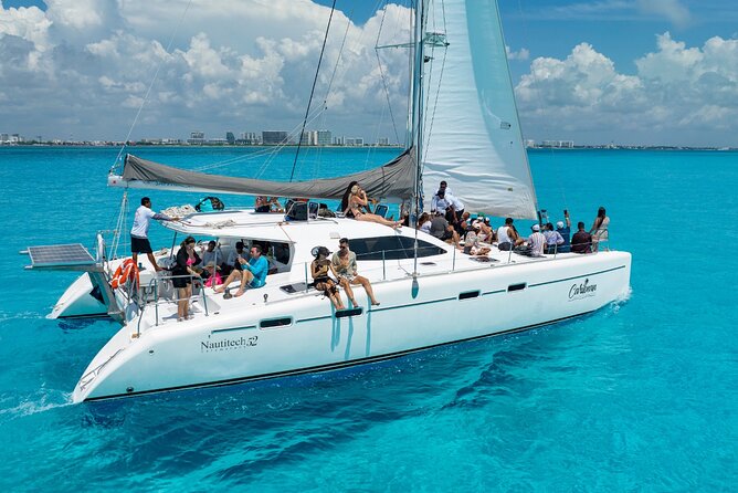 Cancun Catamaran: Isla Mujeres, Snorkeling, Drinks & Buffet Lunch - Sailing across the Caribbean