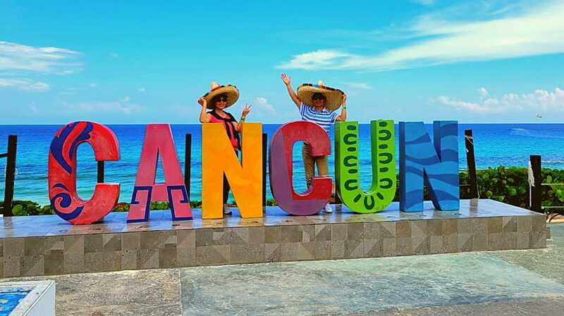 Cancun: Guided City Tour with Shopping by Double Decker Bus - Boulevard Kukulcan from the top deck