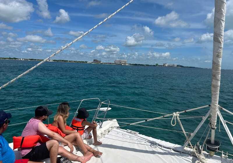 Cancun: Isla Mujeres Catamaran with buffet, drinks & snorkel - Sailing toward Isla Mujeres with the bar open