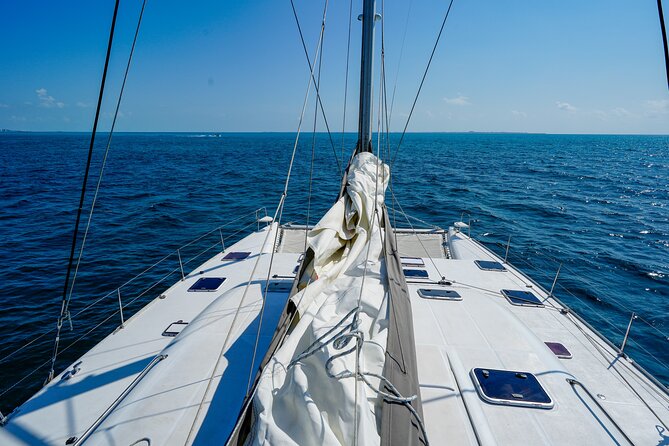 Cancun Private Catamaran Cruise– Open Bar & Snorkeling Experience - Booking timing, weather, and cancellation