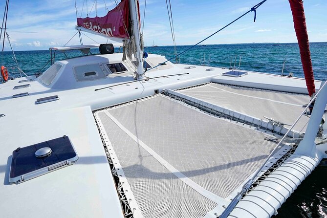 Catamaran to Isla Mujeres – Kids Go Free! (Only Pay Dock Fee) - Buffet lunch at the beachfront restaurant