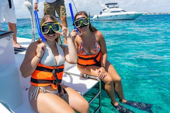 Catamaran Tour to Isla Mujeres Cancun - A reef stop near the Museo Subacuático de Arte