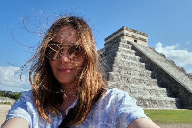 Chichen Itza Exclusive Tour, Cenote, Magical Town & Buffet - Walking through Chichen Itza with a bilingual guide