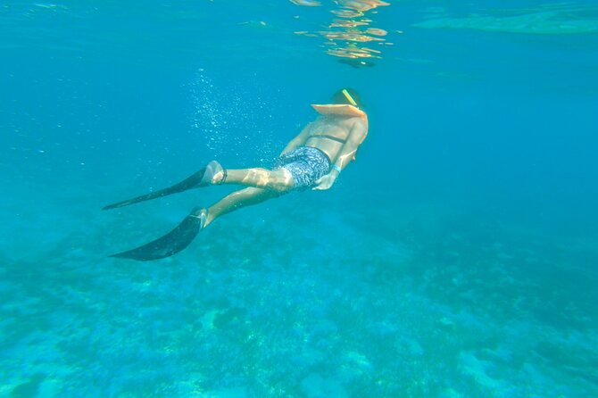 Dancer Cruise Isla Mujeres Snorkel Food and Drinks Included - The boat’s slide and swim stop