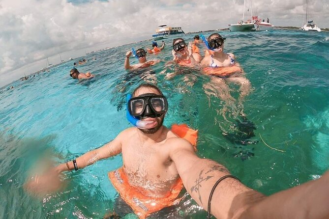 Deluxe Catamaran to Isla Mujeres, with Drinks, Snorkel & Buffet - Transport, meeting point, and group size