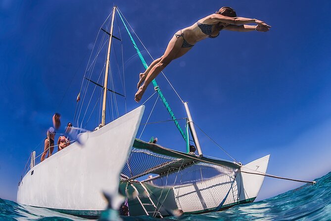 Discover Isla Mujeres: Catamaran, Snorkeling, and "Ice Bar" - Morning pickup and the marina wait