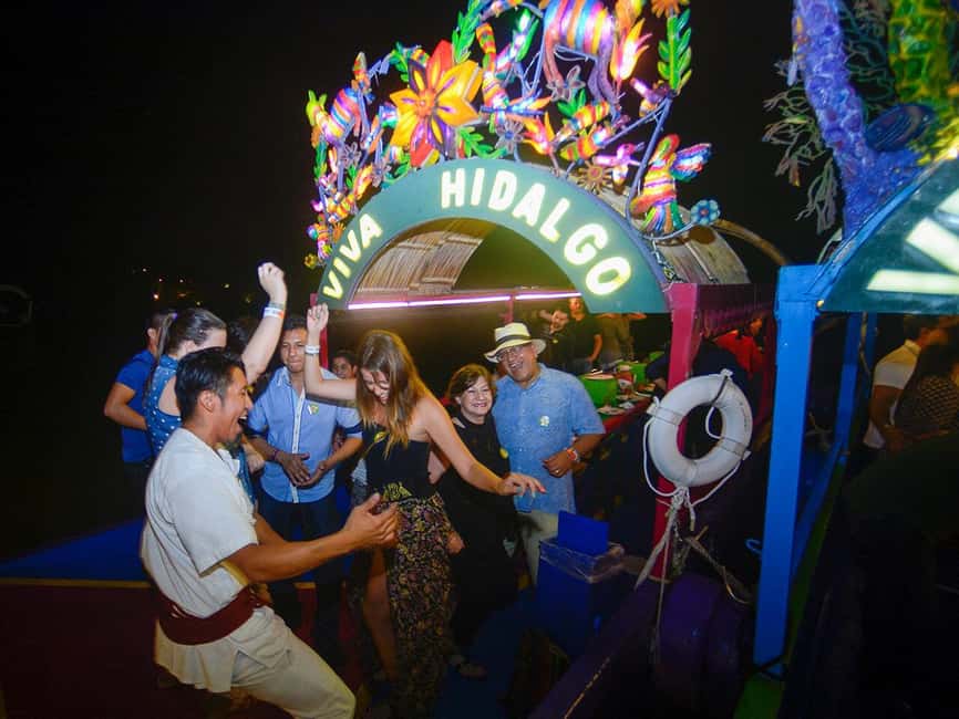 From Cancun: All-Inclusive Xoximilco Park Admission - Arriving at Xoximilco after sunset
