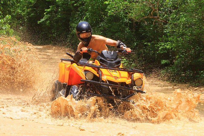 Hidden Cenote Swim & ATV Jungle Adventure with Transportation - Riding the Can-Am Outlander through the forest