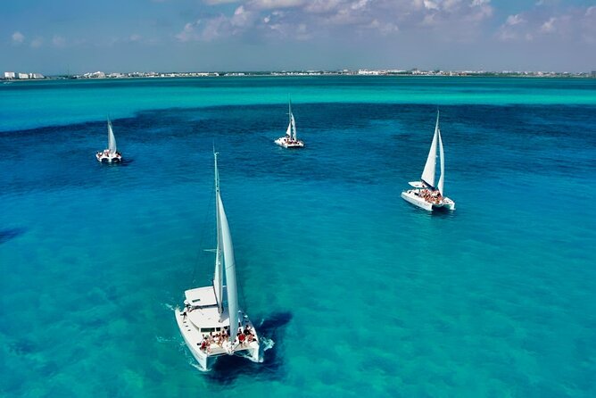 Isla Mujeres Catamaran Sailing Experience with Lunch & Open Bar - Returning through the sunset