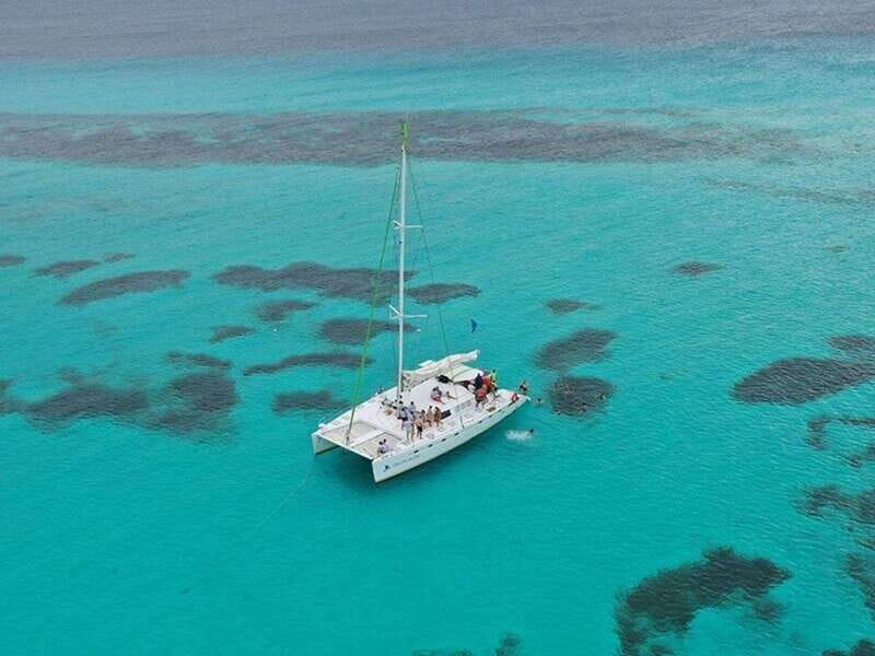 Isla Mujeres Catamaran Tour: Snorkel & Beach Adventure - Lunch, drinks, and the beach club stop