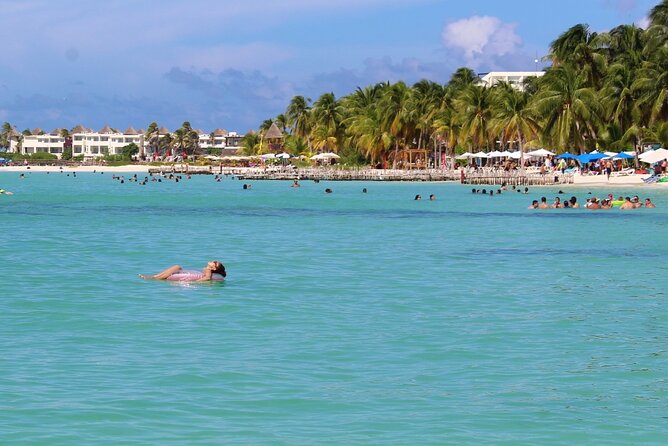 Isla Mujeres Catamaran Tour with Snorkeling at MUSA, Buffet Lunch & Open Bar - Sailing back with drinks and music