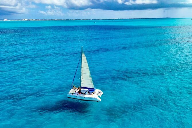 Isla Mujeres: Catamaran Tour with Snorkeling Food, Drinks, Beach - Spinnaker flight and the party boat home