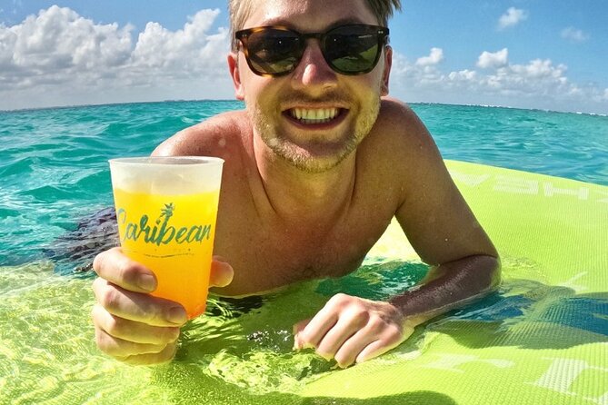 Isla Mujeres Catamaran Tour with Snorkeling, Open Bar & Buffet - A 90-minute beach club stop with Mexican food