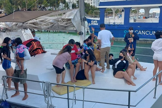 Isla Mujeres Premium Tour in Catamaran with Snorkel and Buffet - El Meco reef: colorful fish, sculptures, and limited water time