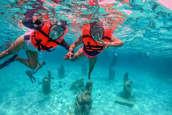Isla Mujeres Spring Break Party Catamaran Snorkel and Open Bar - Snorkeling in clear Caribbean water