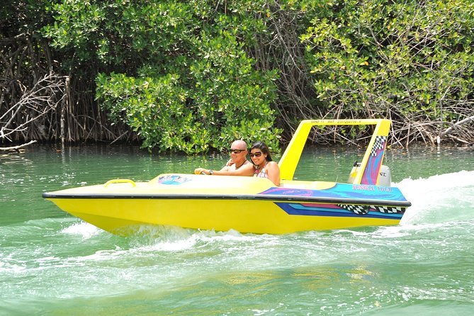 Jungle Tour with Snorkel in Cancun - Learning to handle the two-person speedboat
