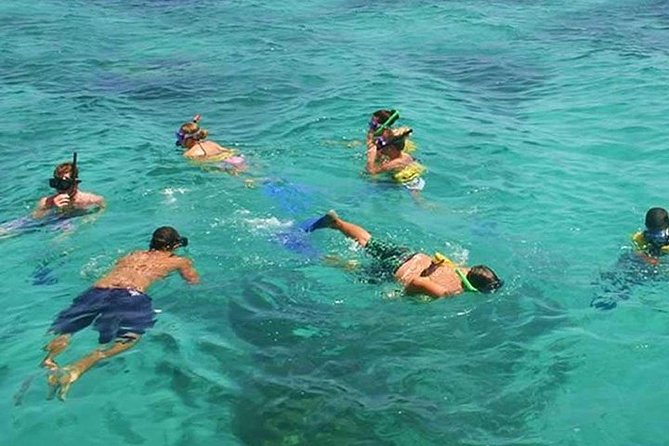 Live The Luxury Catamaran Isla Mujeres Tour in Cancun - The beach club, buffet, and pool stop