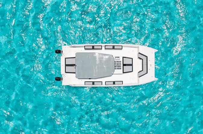 Private Atomic Catamaran Tour to Isla Mujeres - Weather, cancellation, and practical limits