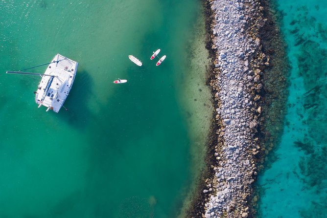 Riviera Maya Luxury Snorkeling Cruise with Lunch and Drinks - The second stop: paddleboards, mats, and shallow water